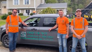 Discount Asphalt Paving crew preparing residential driveway base in Maine